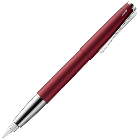 Lamy Studio fountain pen in Royal Red with sleek design and metal accents, showcasing its elegant writing instrument features