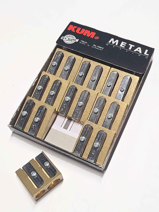 KUM 300-2 Brass Pencil Sharpener with durable metal casing and dual sharpening holes for precise pencil sharpening.