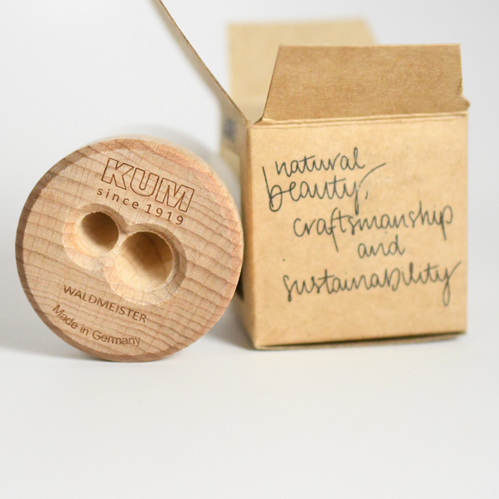 KUM Frosted Glass Pencil Sharpener with Waldmeister design, showcasing the compact, transparent sharpener in a close-up view.
