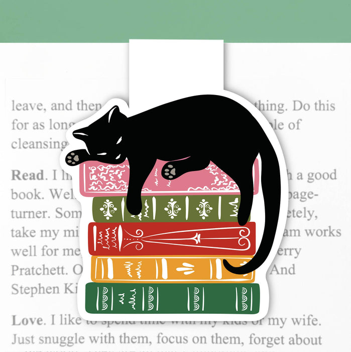 Magnetic cat bookmark from Lucy Loves Paper holding a book open with a cute feline design and colorful magnetic closure.
