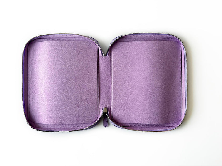 Light lavender leather pen case by Eng Leather Co. with 18 slots for storing pens and writing instruments.