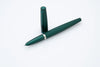 Diplomat Viper fountain pen with green ink and sleek design, showcasing its elegant nib and smooth writing surface.
