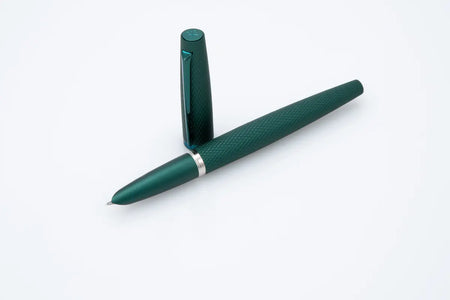 Diplomat Viper fountain pen with green ink and sleek design, showcasing its elegant nib and smooth writing surface.