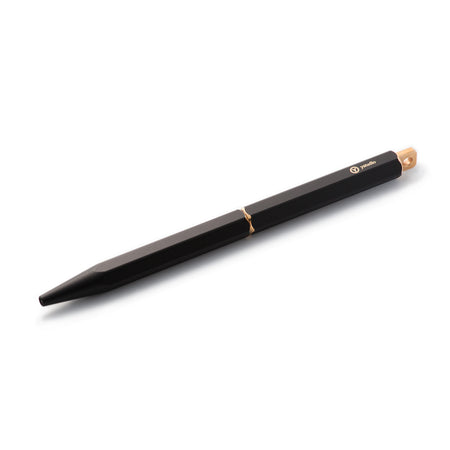 Black Y Studio Brassing portable ballpoint pen displayed from the side, showcasing its sleek design and compact size.