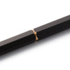 Black Y Studio Brassing portable ballpoint pen with sleek design, shown from the side on a neutral background.
