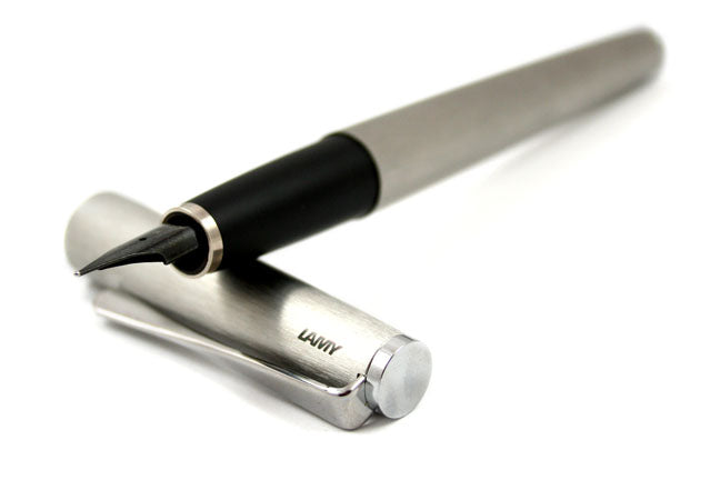 Lamy Studio fountain pen with brushed steel finish, showcasing its sleek design and fine nib for smooth writing.