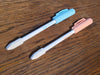 KUM Tip Top Pastel pens with pastel-colored caps and bodies, ideal for writing and drawing projects.