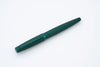 Diplomat Viper green fountain pen with a sleek design and gold accents, showcasing its smooth writing nib and elegant body.