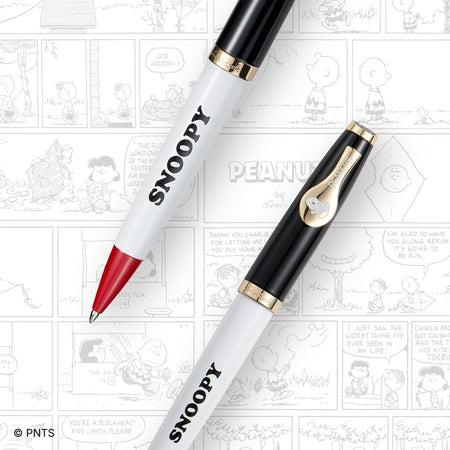 Esterbrook x Peanuts ballpoint pens featuring Snoopy and Woodstock with colorful, cartoon-inspired designs.