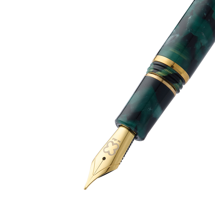 Esterbrook Estie Evergreen fountain pen ink bottle with green ink, showcasing the product in a clear glass container.
