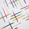 Set of 24 Blackwing Colors pencils with vibrant colored barrels and black erasers, arranged in a neat display.