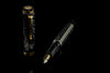 Omas Cobra limited edition fountain pen with sleek black body and gold accents, detailed close-up of the elegant writing instrument.
