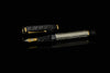 Omas Cobra limited edition fountain pen with black and gold design, showcasing smooth body and elegant nib.