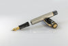Omas Cobra Limited Edition fountain pen with sleek black design and gold accents, showcasing its elegant craftsmanship.