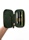 Eng Leather Co. 3-slot leather pen case in natural olive leather with visible stitching and a sleek, compact design.
