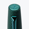 Diplomat Viper roller ball fountain pen with a green barrel and sleek design, showcasing its elegant writing instrument style.