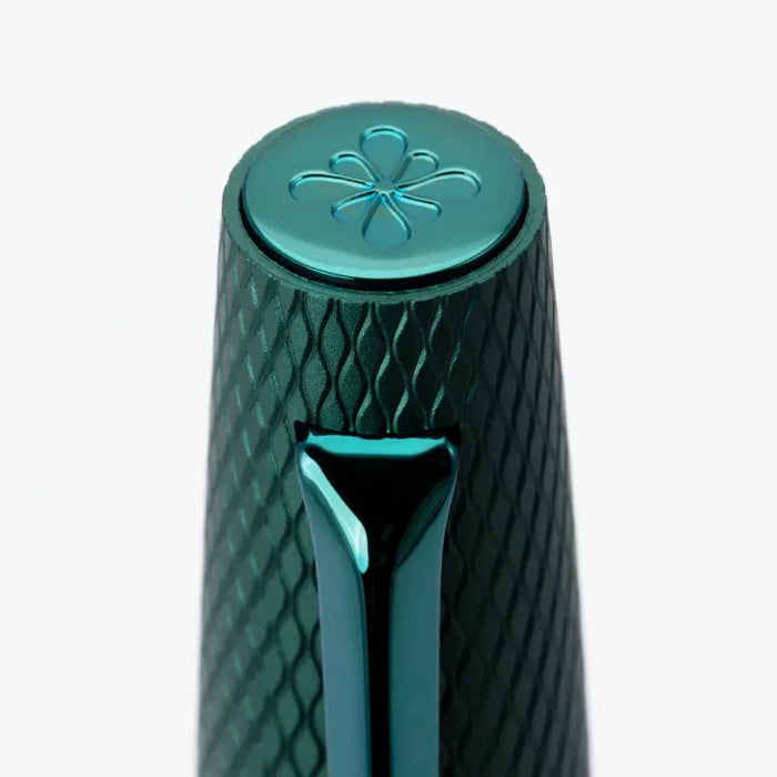 Diplomat Viper roller ball fountain pen with a green barrel and sleek design, showcasing its elegant writing instrument style.