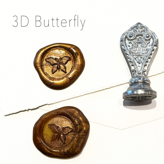 Le Potier D'etain wax seal with 3D butterfly design, featuring intricate detailing on a metallic wax seal.