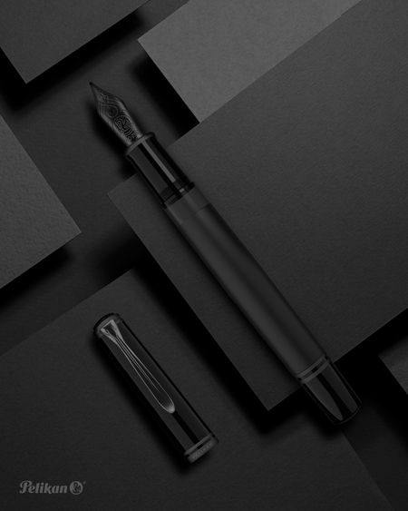 Pelikan Souverän M809 black matte fountain pen with gold accents and a textured grip section.