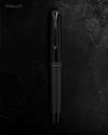 Pelikan Souverän M809 black matte fountain pen with gold accents and textured grip section.