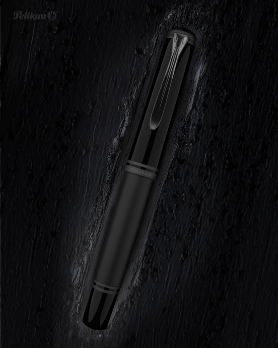 Pelikan Souverän M809 black matte fountain pen with gold accents and smooth grip section.