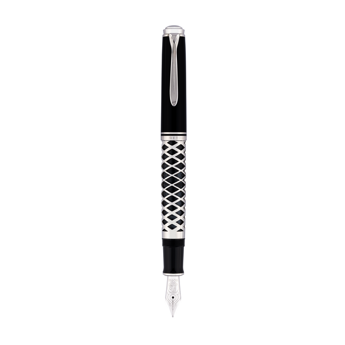 Pelikan Souverän M805 fountain pen with metal sleeve and gold accents, showcasing its elegant black resin body and detailed nib.