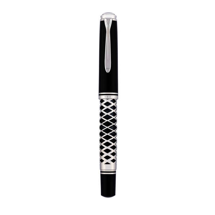 Pelikan Souverän M805 fountain pen with metal sleeve, featuring gold accents and a black resin body.