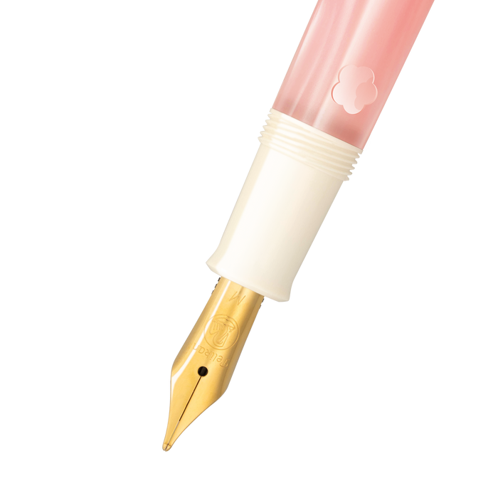 Pelikan M200 Cherry Blossom fountain pen with pink and white marbled body and gold accents, close-up view.