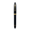 Omas Ogiva Nera fountain pen with black body and gold accents, showcasing its elegant design and smooth writing tip.