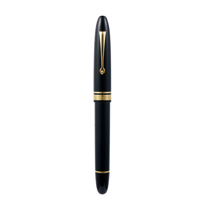 Omas Ogiva Nera fountain pen with black body and gold accents, showcasing its elegant design and smooth writing tip.