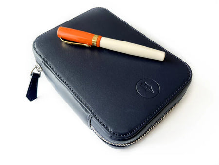 Navy blue leather 4-slot A6 pen case by Eng Leather Co. with sleek design and stitched edges for organized pen storage.