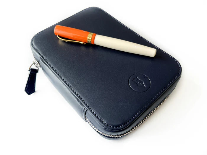 Navy blue leather 4-slot A6 pen case by Eng Leather Co. with sleek design and stitched edges for organized pen storage.