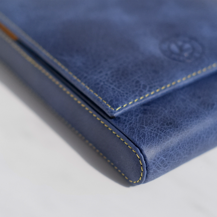 Blue leather pen case by Eng Leather Co. with five compartments, designed for stylish storage of writing instruments.