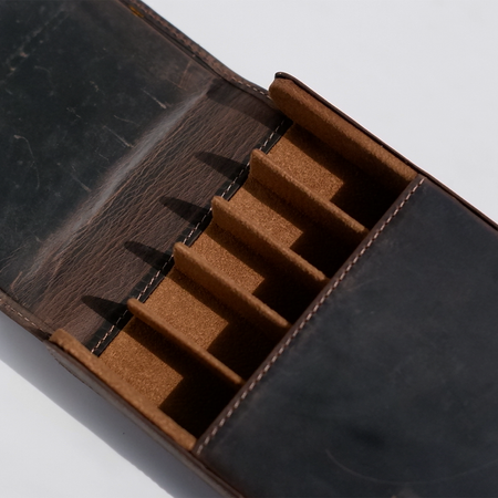 Dark brown Eng Leather Co. 5 pen hard case with sturdy exterior and secure closure, designed to protect and organize writing instruments.
