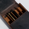 Dark brown Eng Leather Co. 5 pen hard case with sturdy exterior and secure clasps for organized storage of writing instruments.