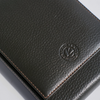Green leather pen case by Eng Leather Co. holding five pens with a sleek, compact design and secure closure.