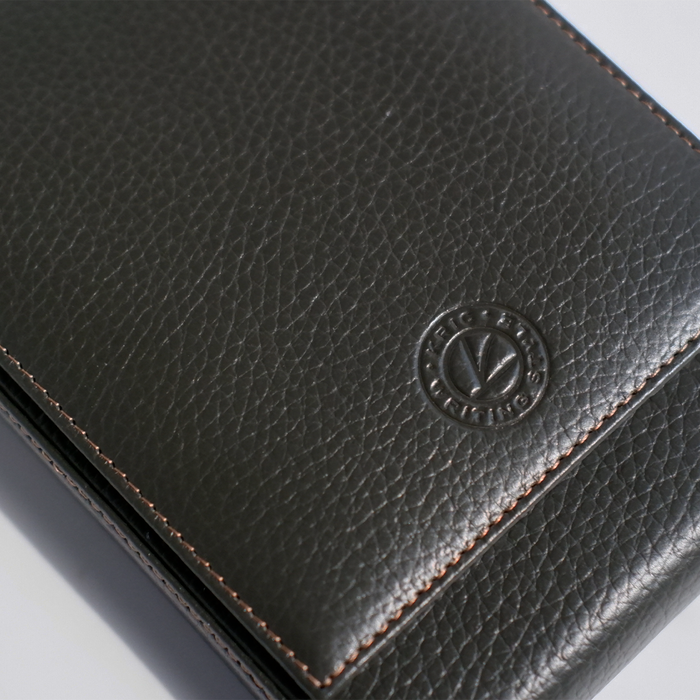 Green leather pen case by Eng Leather Co. holding five pens with a sleek, compact design and secure closure.