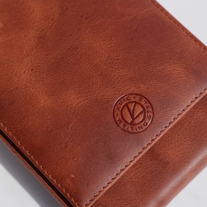 Light brown Eng Leather Co. 5 Pen Hard Case with sturdy exterior and secure closure, designed to protect and organize pens.