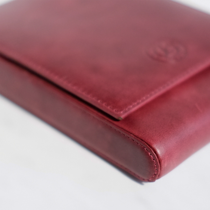 Red leather pen case by Eng Leather Co. with five compartments, designed for storing and organizing pens securely.