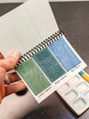 Peerless Watercolors Mini Complete Edition set of watercolor pans with vibrant colors and compact design for painting on the go.