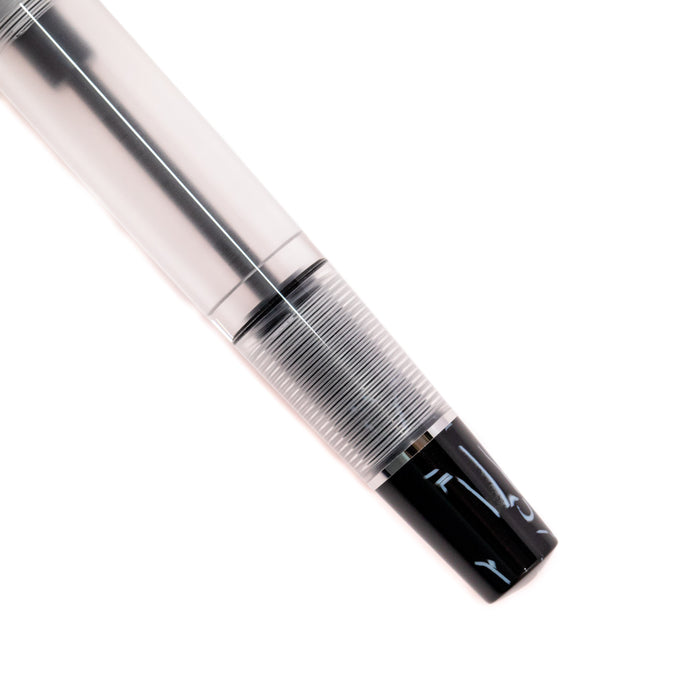 Opus 88 KOLORO black fountain pen with a sleek design and gold accents, showcasing the pen's clip and fine nib.