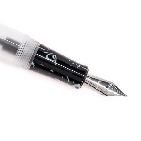 Opus 88 KOLORO black fountain pen with gold accents, showcasing its sleek design and fine nib.