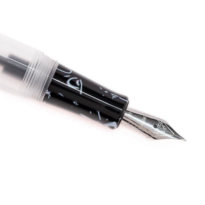 Opus 88 KOLORO black fountain pen with gold accents, showcasing its sleek design and fine nib.