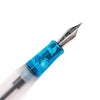 Opus 88 KOLORO Light Blue fountain pen with transparent blue barrel and silver clip, showcasing elegant design and craftsmanship.