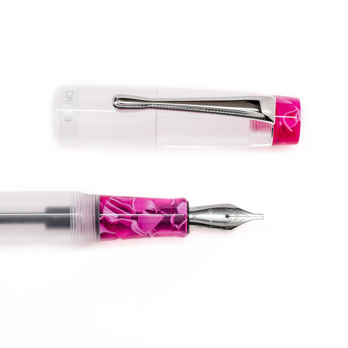Opus 88 KOLORO hot pink fountain pen with transparent body and gold accents, showcasing a sleek, modern design.