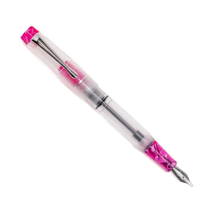 Opus 88 KOLORO Hot Pink fountain pen with transparent body and gold accents, showcasing its elegant design.