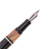 Opus 88 Buffalo horn fountain pen with gold nib, featuring a sleek design and transparent ink window, crafted by Opus88.