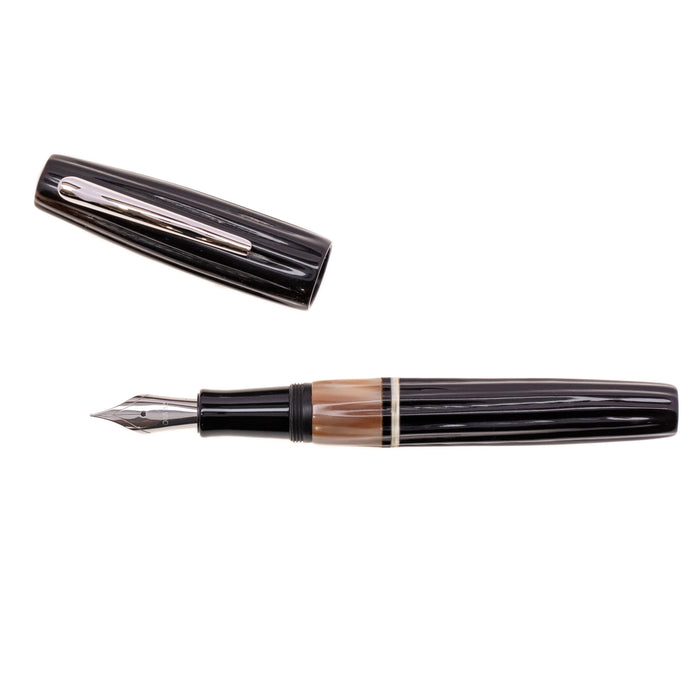 Opus 88 Buffalo Horn Fountain Pen with gold accents, showcasing a smooth, handcrafted design and elegant nib.