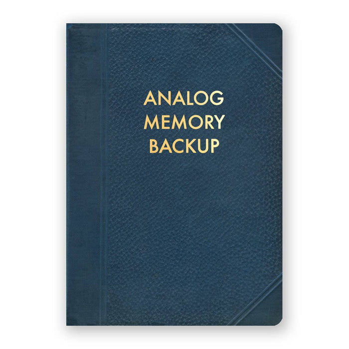 Medium Analog Memory Backup Journal by The Mincing Mockingbird with a kraft paper cover and black binding, open to blank lined pages.