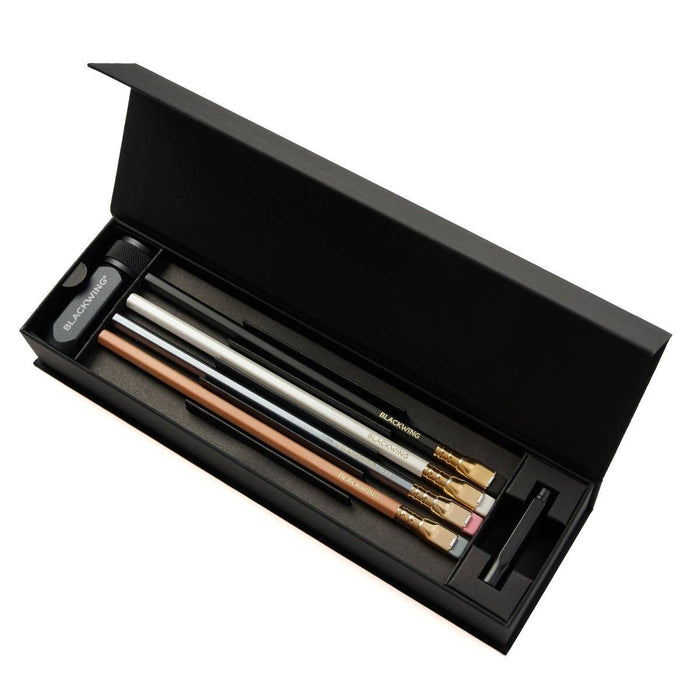 Blackwing Pencil Essentials Set featuring assorted black pencils with silver accents and a sleek storage case.